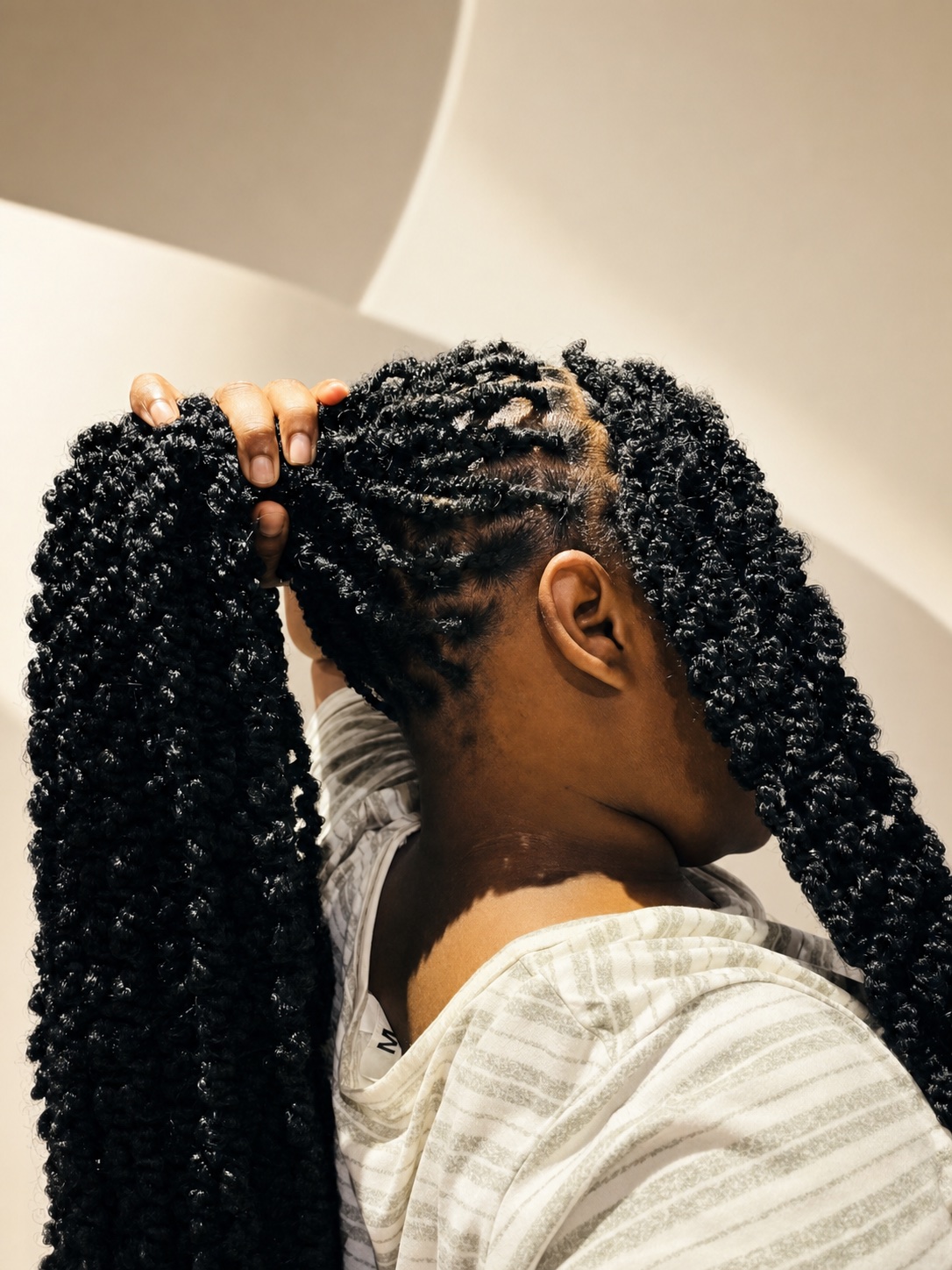Client showcasing a detailed twist hairstyle