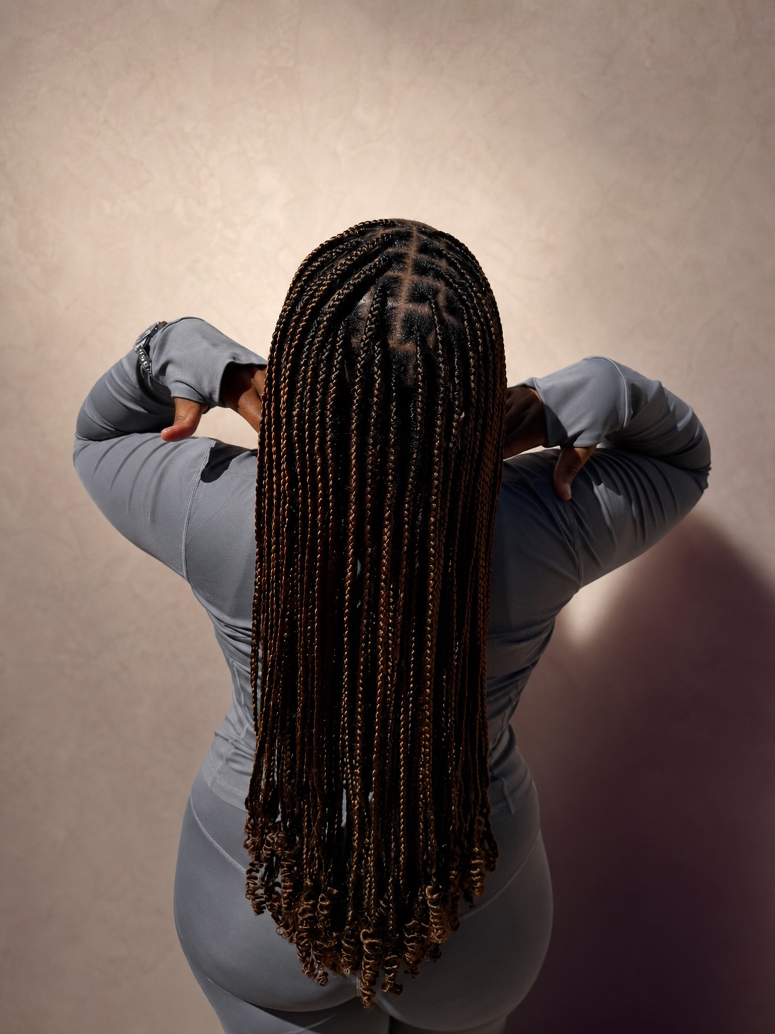 Long protective box braids with curled ends